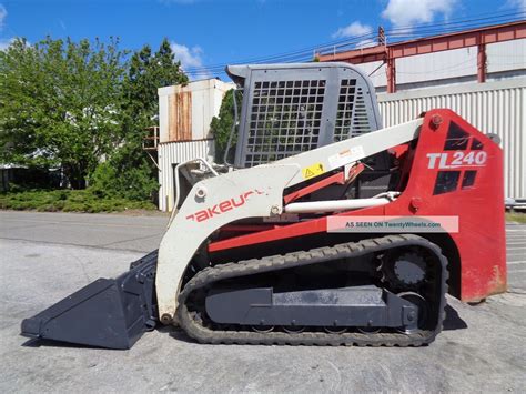 takeuchi skid steer tracks tl240|takeuchi tl240 lift capacity.